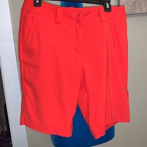 Orange Nike golf shorts